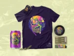 The trippy monkey artwork on a dark t-shirt surrounded by a drink can, ashtray, prerolls and lighter.